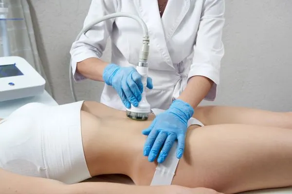 Lost the Weight but Not the Loose Skin? 2 woman having HIFU treatment on her stomach to combat loose skin Warwick following weight loss